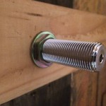 View from the back of the bar, reattaching the hex nut to the beer shank to secure the shank in place.