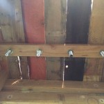View from the back of the bar, reattaching the hex nut to the beer shank to secure the shank in place.