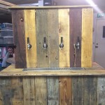 Front view of bar with shanks and faucets installed